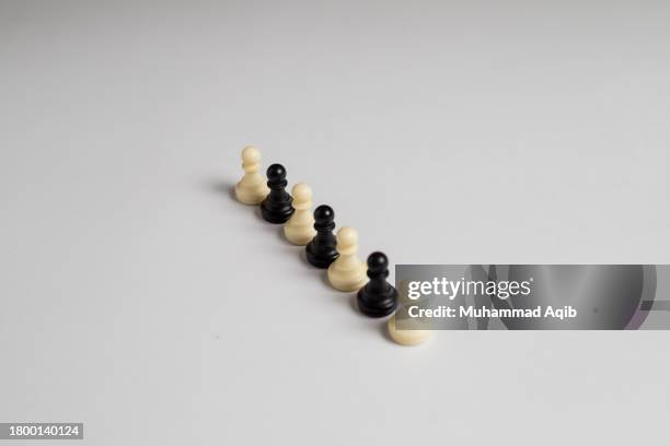 black and white chess pieces in one line - chess icon stock pictures, royalty-free photos & images