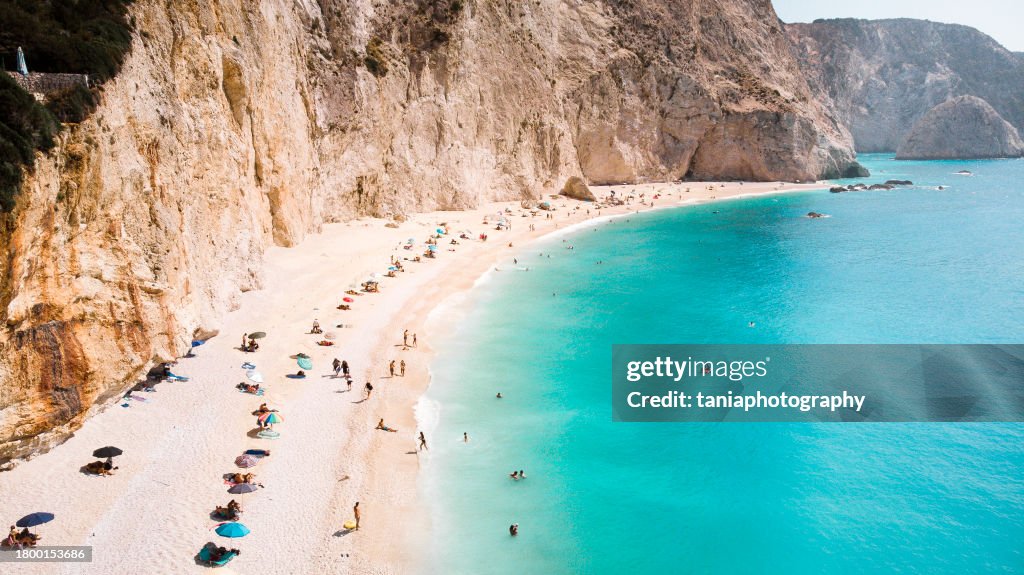 Small natural beach in Greece with blue and green colors of water