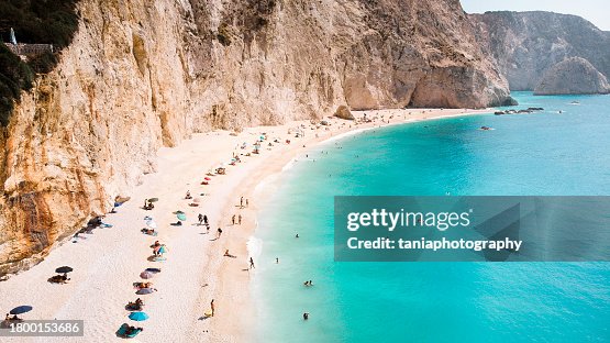 small natural beach in Greece with blue and green colors of water