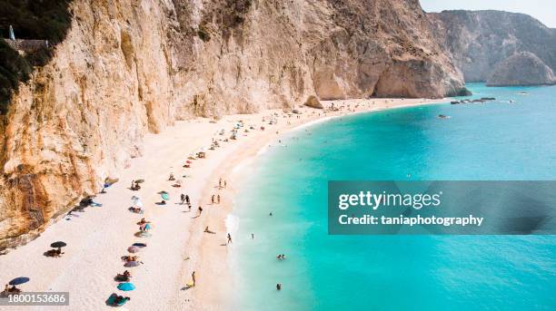 small natural beach in greece with blue and green colors of water - aerial views stock pictures, royalty-free photos & images