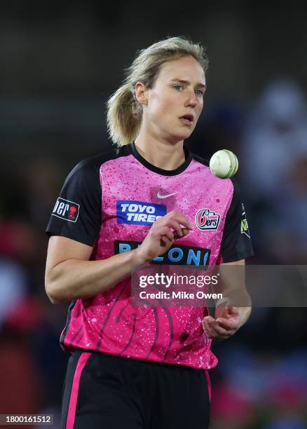 Ellyse Perry of the Sixers prepares to bowl during the WBBL match between Sydney Sixers and Adelaide Strikers at North Sydney Oval, on November 18 in...