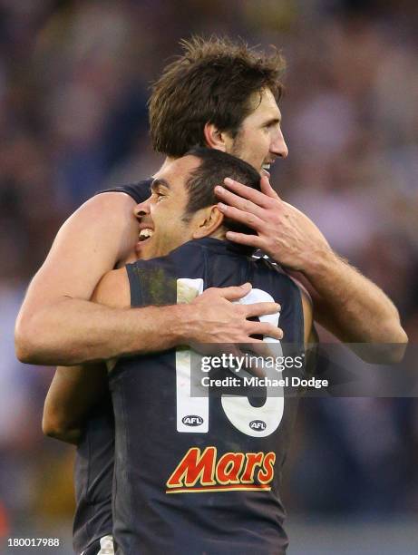 Jarrad Waite and Eddie Betts of the Blues celebrate their win after the final siren during the First Elimination Final AFL match between the Richmond...