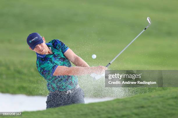 Matt Wallace of England plays his third shot on the 18th hole from a bunker during Day Three of the DP World Tour Championship on the Earth Course at...