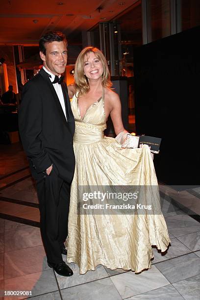 Olivia Pascal Und Peter Kanitz Bei Der "Starlight Yellow" Premiere Von Veuve Clicquot In Der Clicquot City In München .