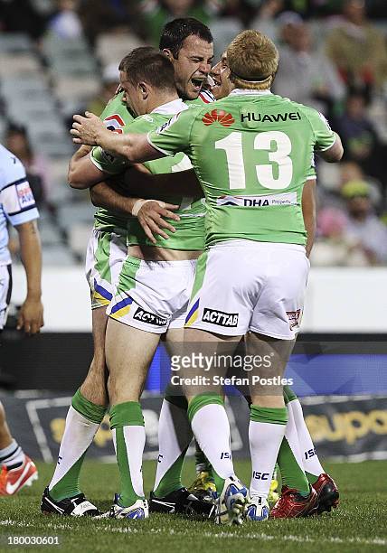 David Shillington of the Raiders is congratulated after scoring a try during the round 26 NRL match between the Canberra Raiders and the Cronulla...