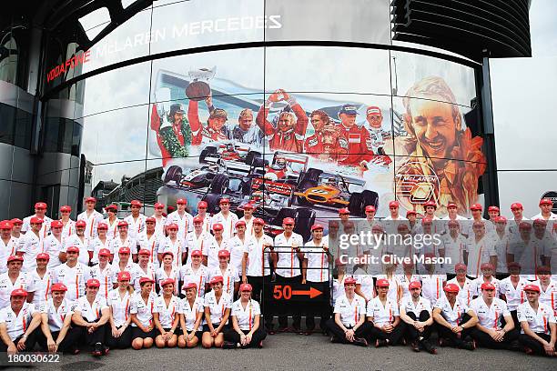 Jenson Button, Martin Whitmarsh and Sergio Perez and McLaren team mates pose for a team photograph as they celebrate their 50th year in Formula One...