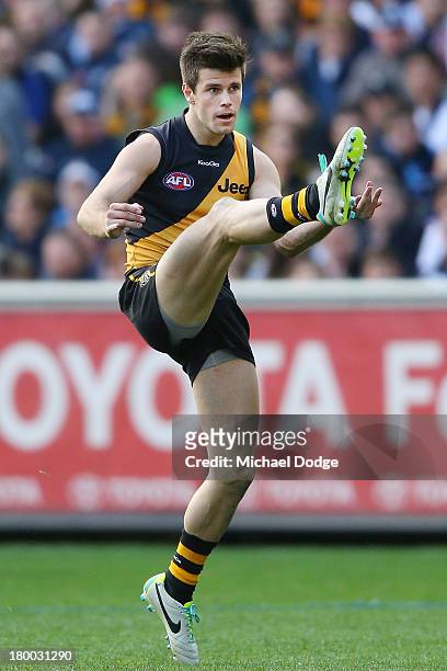 Trent Cotchin of the Tigers kicks the ball during the First Elimination Final AFL match between the Richmond Tigers and the Carlton Blues at...