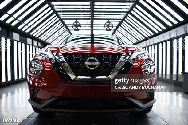 Nissan Juke hybrid car is pictured on the production line at the Nissan production plant in Sunderland, north east England on November 24 where the...