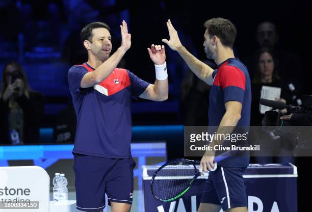 Horacio Zeballos of Argentina and Marcel Granollers of Spain celebrate match point in the Men's Double's Semi Final match on day seven of the Nitto...