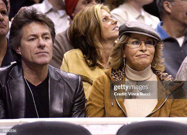 Actress Raquel Welch and husband Richard Palmer attend the game between the Los Angeles Lakers and the New York Knicks on February 16, 2003 at...