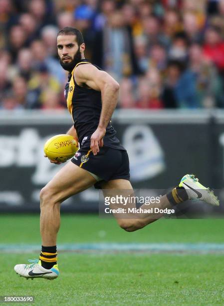 Bachar Houli of the Tigers runs with the ball during the First Elimination Final AFL match between the Richmond Tigers and the Carlton Blues at...