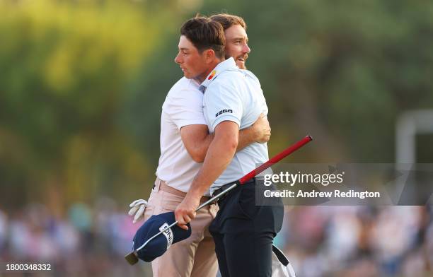 Tommy Fleetwood of England and Viktor Hovland of Norway embrace on the 18th green during Day Three of the DP World Tour Championship on the Earth...