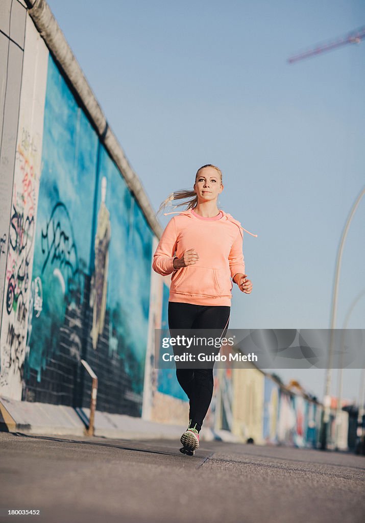 Woman jogging in city.