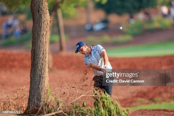 Viktor Hovland of Norway plays his second shot one the 18th hole during the third round on Day Three of the DP World Tour Championship on the Earth...