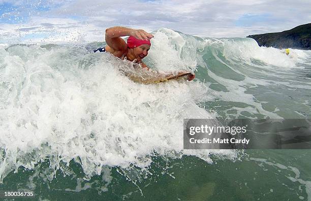 Belly boarders catches a wave as she takes part in the first senior ladies heat of the annual World Belly Boarding Championships at Chapel Porth on...