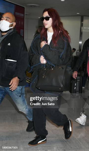 Dua Lipa is seen upon arrival at Narita International Airport on November 18, 2023 in Narita, Japan.