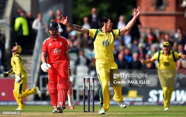 Australia's Mitchell Johnson celebrates dismissing England's Jonathan Trott for 0 during the second one day international cricket match between...