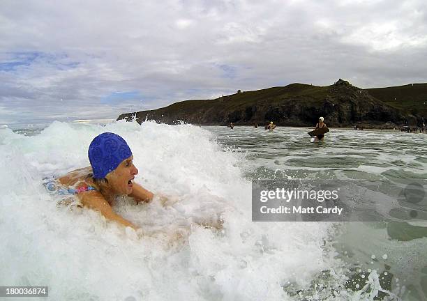 Belly boarders catches a wave as she takes part in the first senior ladies heat of the annual World Belly Boarding Championships at Chapel Porth on...