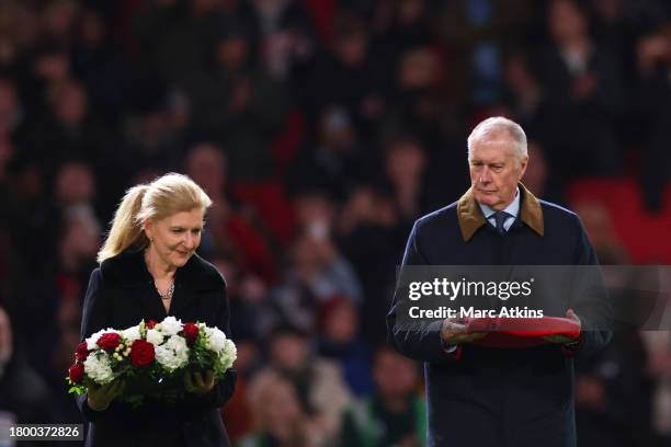 Sir Geoff Hurst and FIFA vice-president Debbie Hewitt lay a wreath on the pitch in remembrance of Sir Bobby Charlton CBE prior to the UEFA EURO 2024...