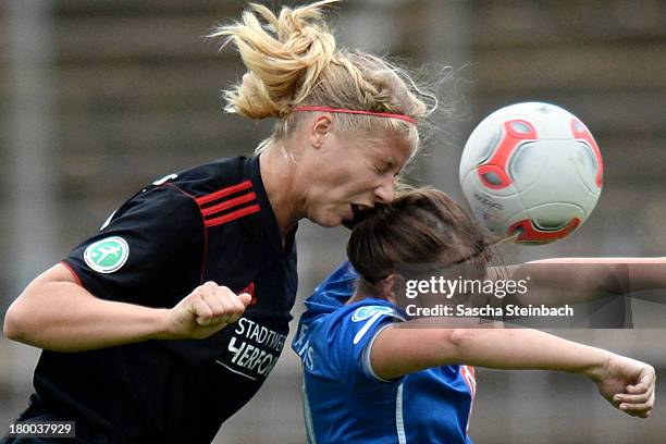 Lena Wermelt of Herford and Madeleine Wojtecki of Luebars battle for a header during the 2. Frauen Bundesliga Nord match between Herforder SV and 1....