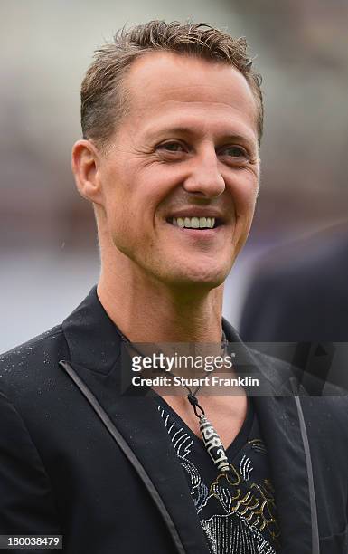 Formula 1 legend Michael Schumacher looks on during the day of the legends event at the Millentor stadium on September 8, 2013 in Hamburg, Germany.