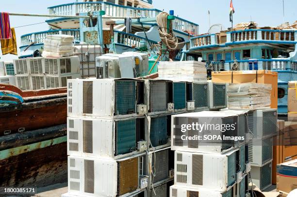 Second-hand air conditioning units are seen piled on the Harbour of Dubai Creek, a busy district for commerce including import and export goods from...