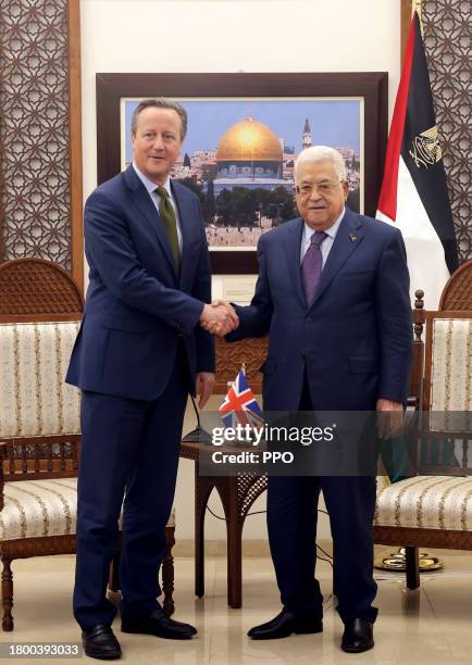 In this handout image released by the Office of the Palestinian President , British Foreign Secretary David Cameron attends a meeting with...