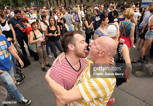 Two men kiss in front of the Russian Embassy as part of the 'To Russia With Love' Global Kiss-In on September 8, 2013 in Berlin, Germany. The event...