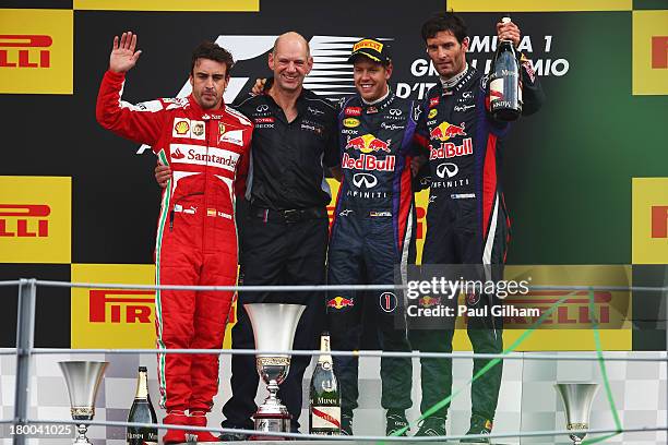 Race winner Sebastian Vettel of Germany and Infiniti Red Bull Racing, second placed Fernando Alonso of Spain and Ferrari, third placed Mark Webber of...