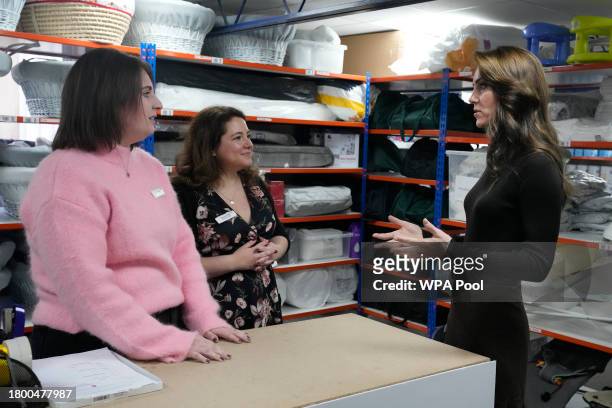 Catherine, Princess of Wales, right with Bianca Sakol, centre, Founder of Sebby's Corner, and Emma Parker the operations manger talk during her visit...