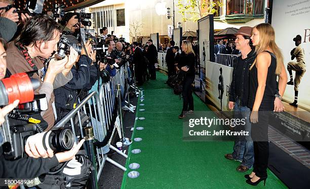 Actor Clifton Collins Jr. And guest arrive to the Los Angeles premiere of The Perfect Game in the Pacific Theaters at the Grove on April 5, 2010 in...