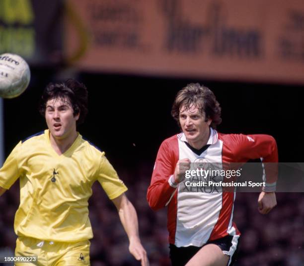 Mick Channon of Southampton and Paul Miller of Tottenham Hotspur compete for the ball during a Football League Division One match at The Dell on...