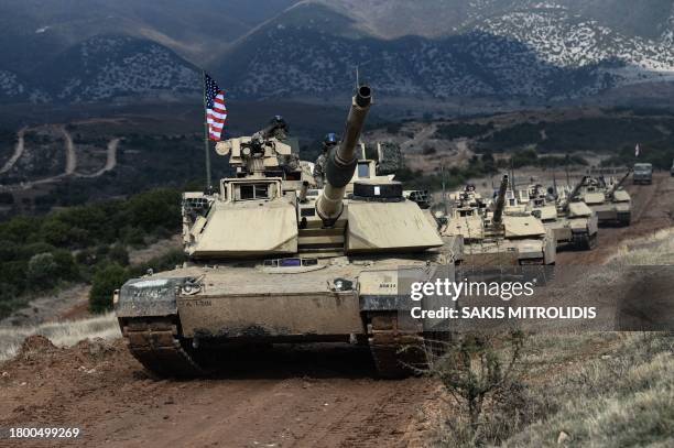 Army officers drive their tanks M1 Abrams during the exercise Olympic Cooperation 23 at the Petrochori training area, near Xanthi, northern Greece,...