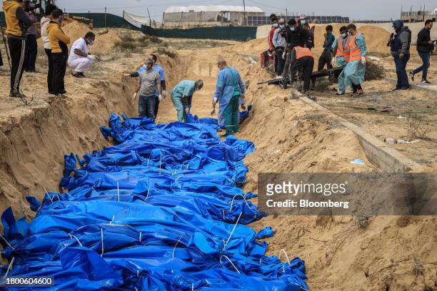 Image depicts death.) A mass grave for the bodies of 111 Palestinians killed during the Israeli bombardment of the Indonesian and Al-Shifa hospitals...