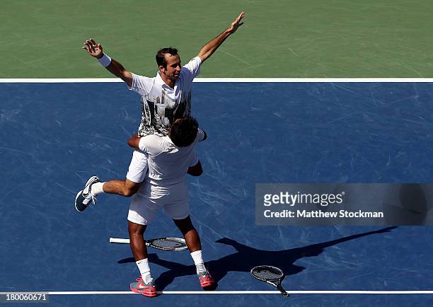 Leander Paes of India and Radek Stepanek of the Czech Republic celebrate winning their men's doubles final against Alexander Peya of Austria and...