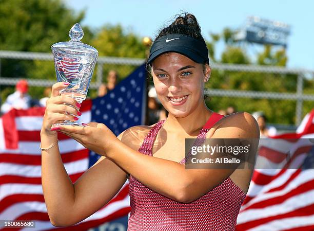 Ana Konjuh of Croatia poses with her trophy after winning her junior girls' singles final match against Tornado Alicia Black of the United States of...