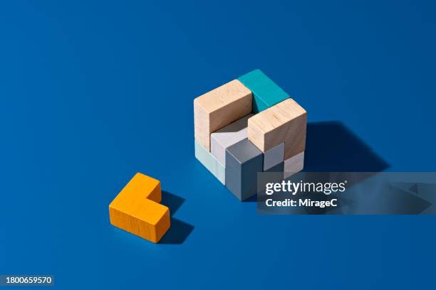 the final piece to solving a puzzle toy - strategy stock pictures, royalty-free photos & images