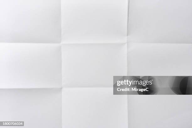 unfolded white paper sheet of grid pattern background - en papier photos et images de collection