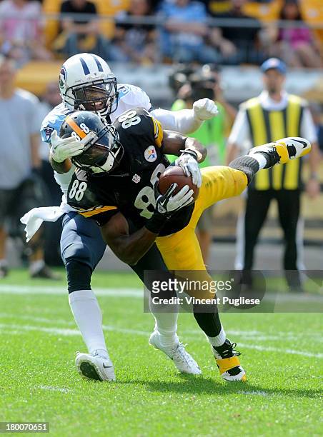 Emmanuel Sanders of the Pittsburgh Steelers makes a diving catch against the Tennessee Titans during the fourth quarter at Heinz Field on September...