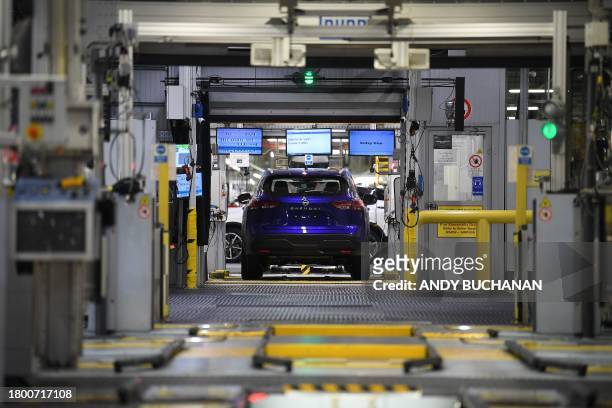 Nissan Qashqai car is pictured on the production line at the Nissan factory in Sunderland, north east England on November 24 where the Japanese...