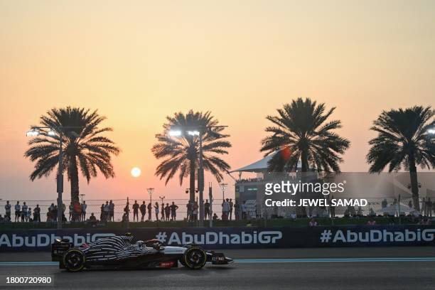 Alpha Tauri's Japanese driver Yuki Tsunoda drives during the second practice session for the Abu Dhabi Formula One Grand Prix at the Yas Marina...