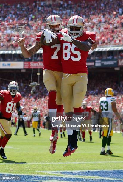 Vernon Davis and Colin Kaepernick of the San Francisco 49ers celebrate after Davis caught a twenty two yard touchddown pass in the first quarter...