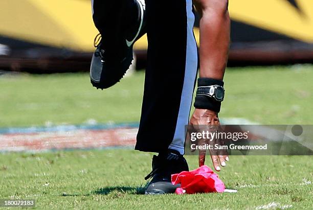 Red flag is picked up by a referee during the game between the Jacksonville Jaguars and the Kansas City Chiefs at EverBank Field on September 8, 2013...