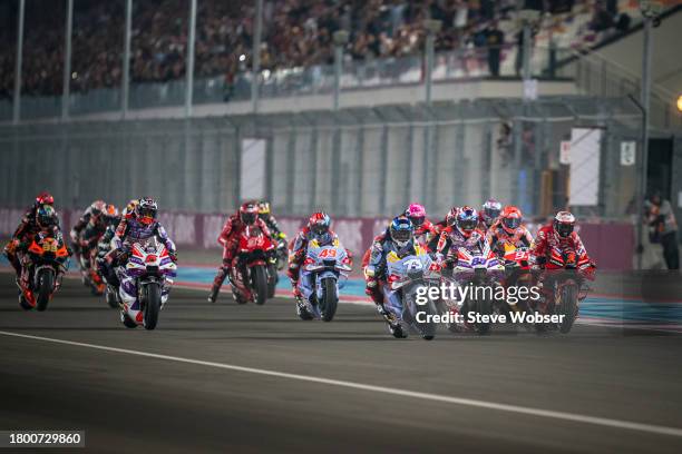 Race start - MotoGP field is running into turn one during the Sprint race of the MotoGP Qatar Airways Grand Prix at Losail Circuit on November 18,...
