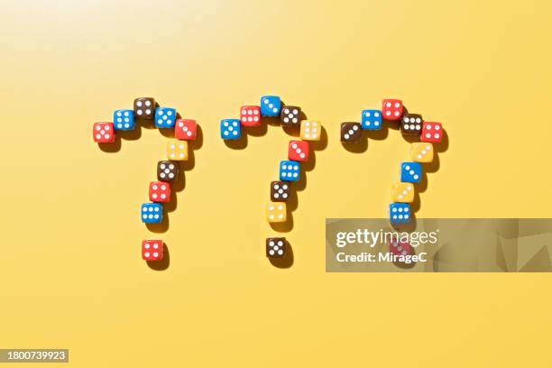 question marks made of multi colored dice - 3 questions stock pictures, royalty-free photos & images
