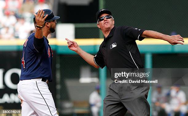 Mike Aviles of the Cleveland Indians is ejected from the game by second base umpire Gary Darling during an argument after he was called out stealing...