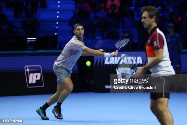 Santiago Gonzalez of Mexico plays a forehand with partner Edouard Roger-Vasselin of France against Rajeev Ram of United States and Joe Salisbury of...