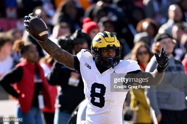 Derrick Moore of the Michigan Wolverines celebrates after returning a fumble for a touchdown in the first quarter against the Maryland Terrapins at...