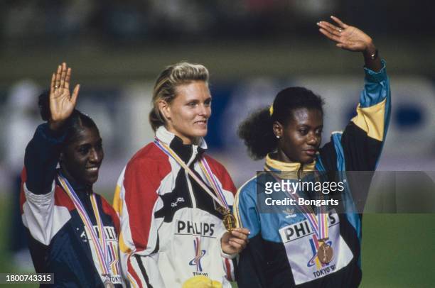 American athlete Gwen Torrence, German athlete Katrin Krabbe, and Jamaican athlete Merlene Ottey on the medal podium at the 1991 IAAF World...