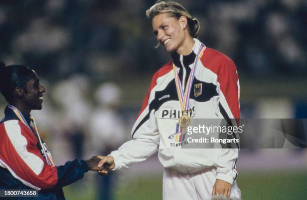 American athlete Gwen Torrence and German athlete Katrin Krabbe during the medal ceremony of the women's 100-metre event at the 1991 IAAF World...